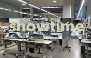 Image of the Fashion and Textiles Studios with the text 'showtime' across the centre
