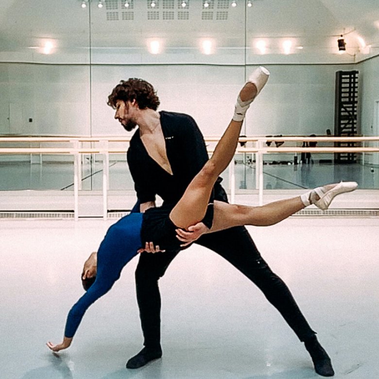 Two dancers from the Royal Opera House performing in a studio
