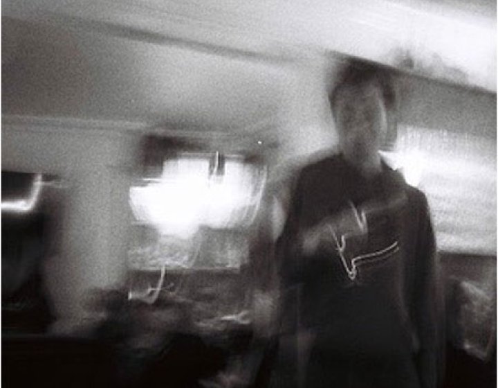 A black and white blurred image of Joe Nichols