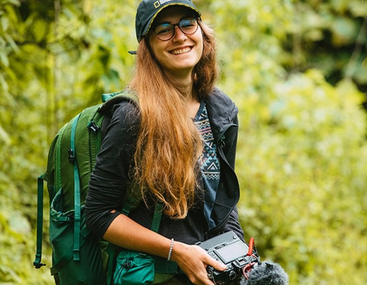 Hedvika Michnova on a location shoot carrying a camera 