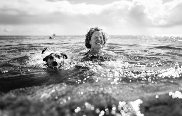 Jane Pugh swimming in the sea with her dog 