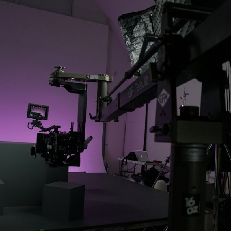 Film studio set lit with purple light