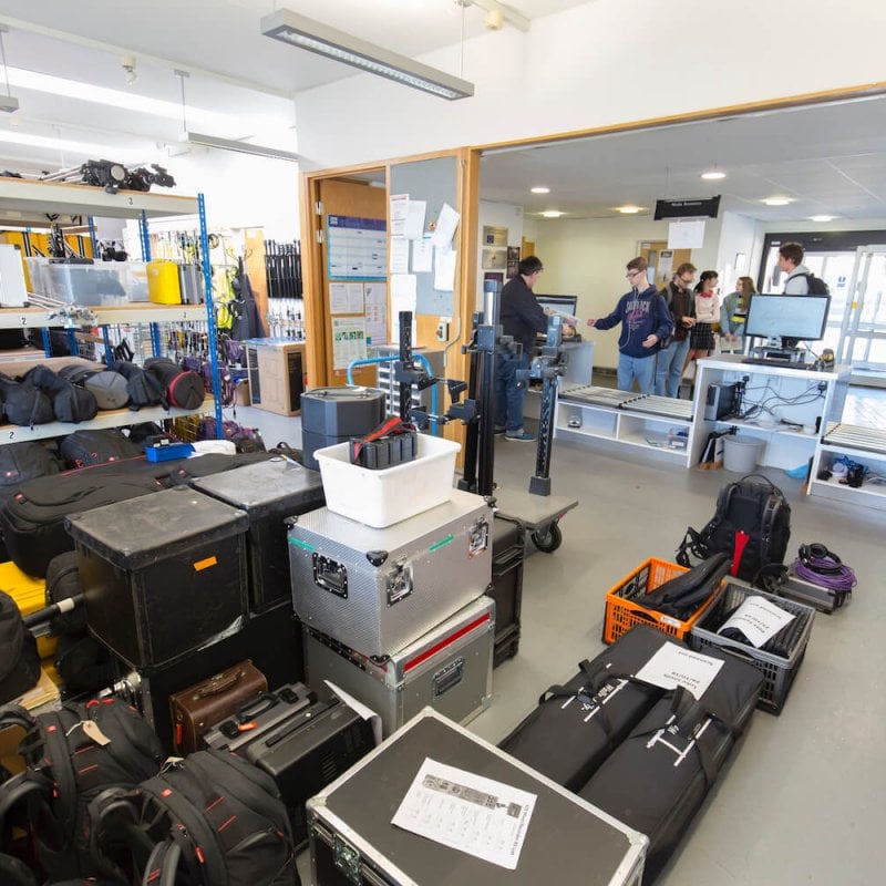 Falmouth's School of Film & Television storeroom room full of equipment in cases and bags.