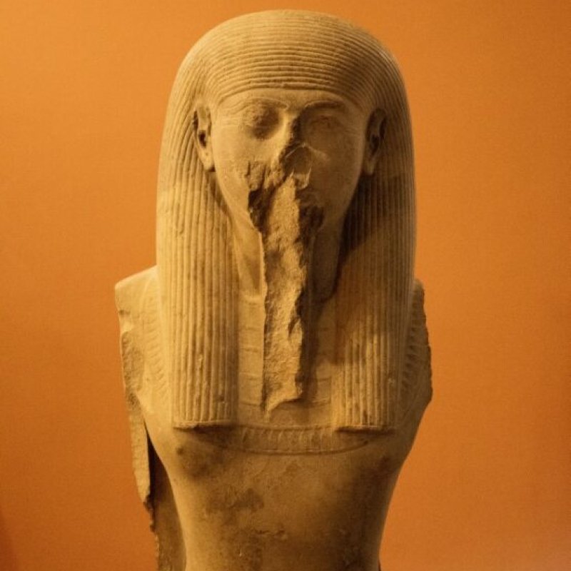 A pharaoh against an orange background