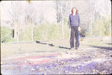 Falmouth University Alumni Jimmy Whitehead standing in front of some trees.