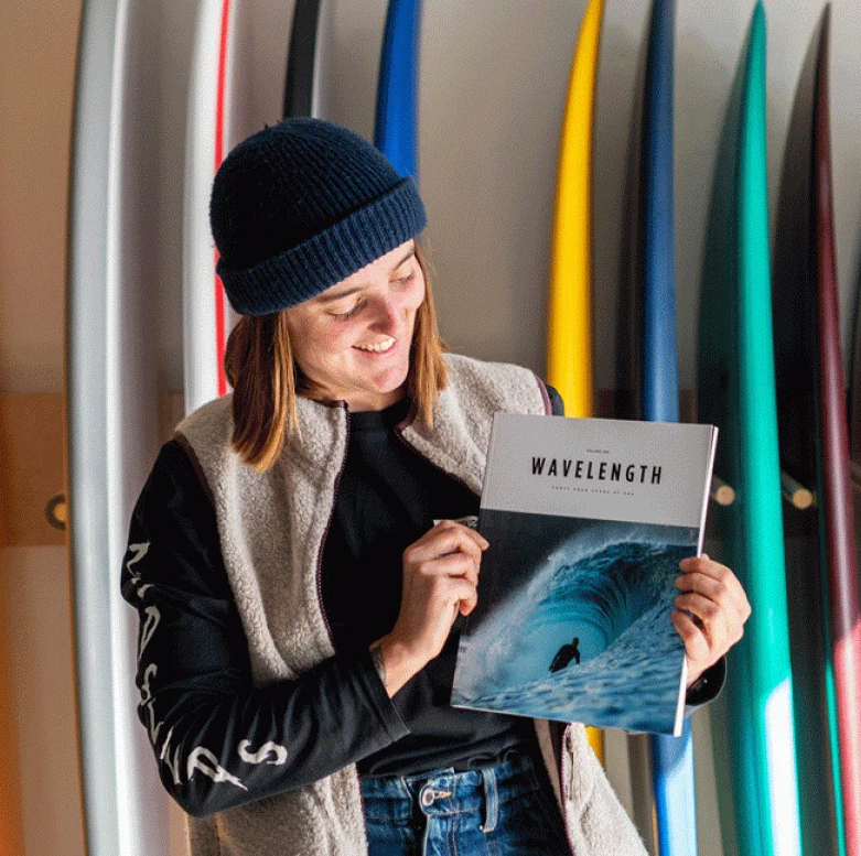 A graduate holding a magazine