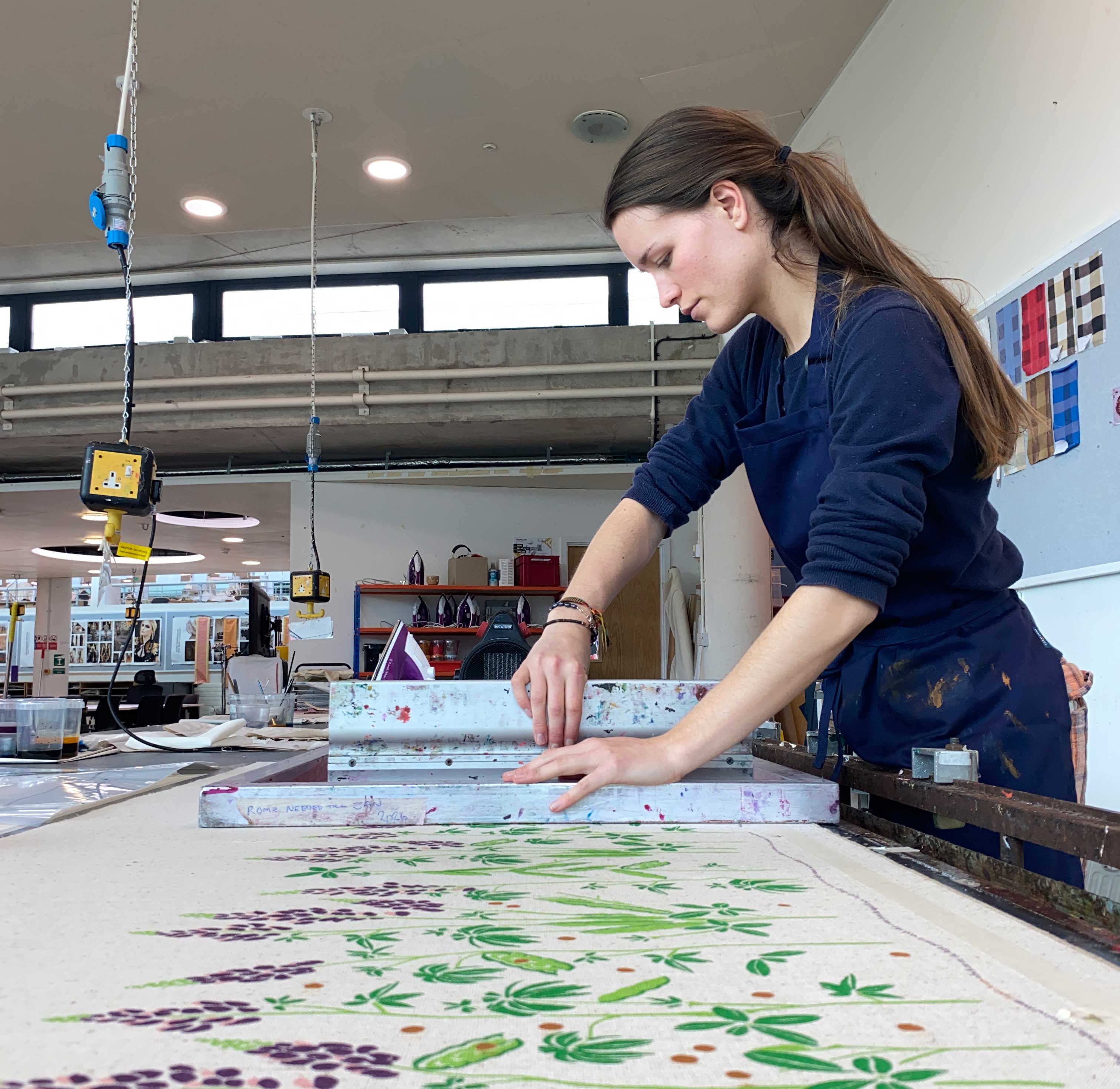 A textiles student in the workshop