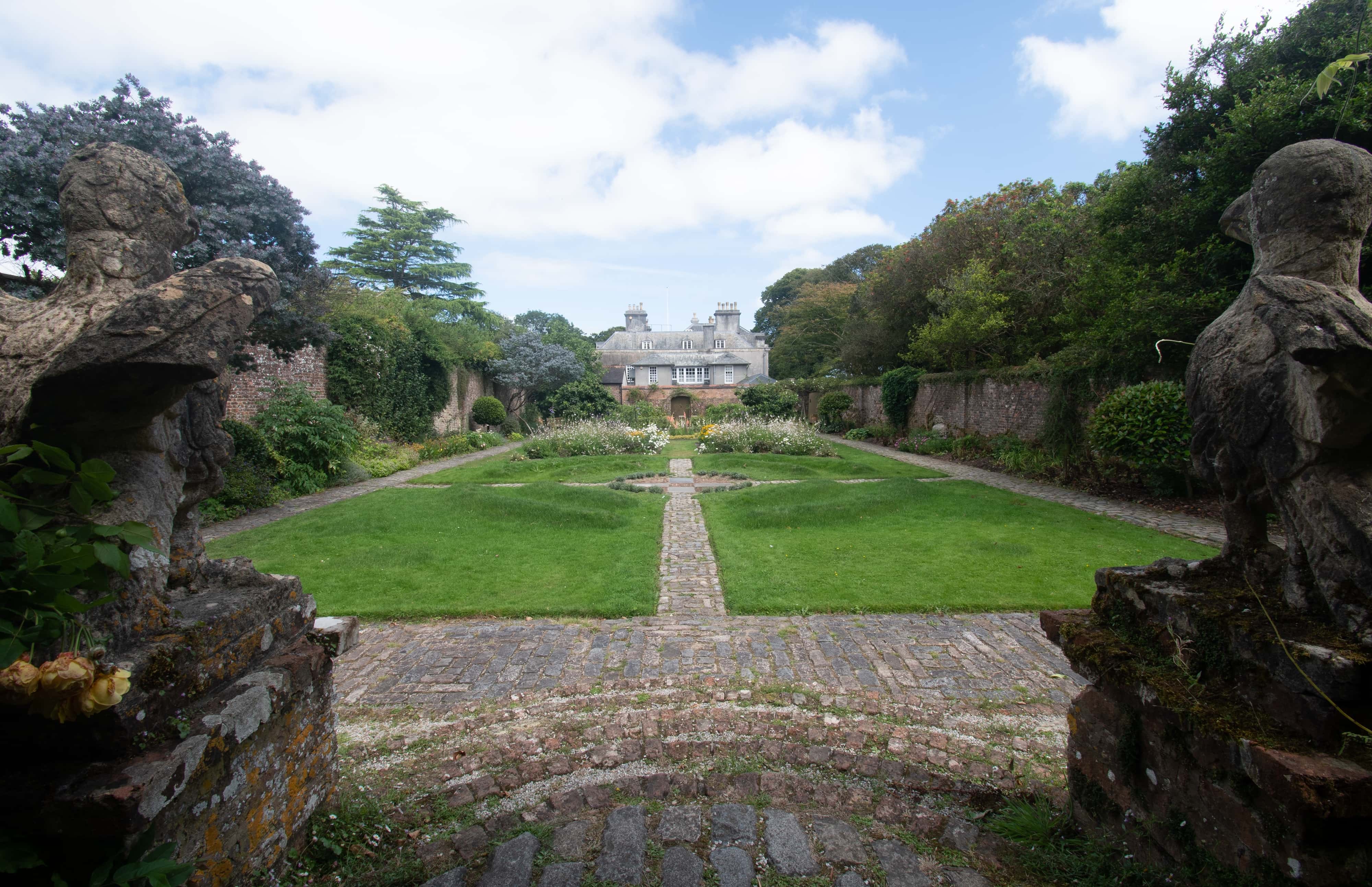 View of the courtyard garden and house at Trewithen, Cornwall