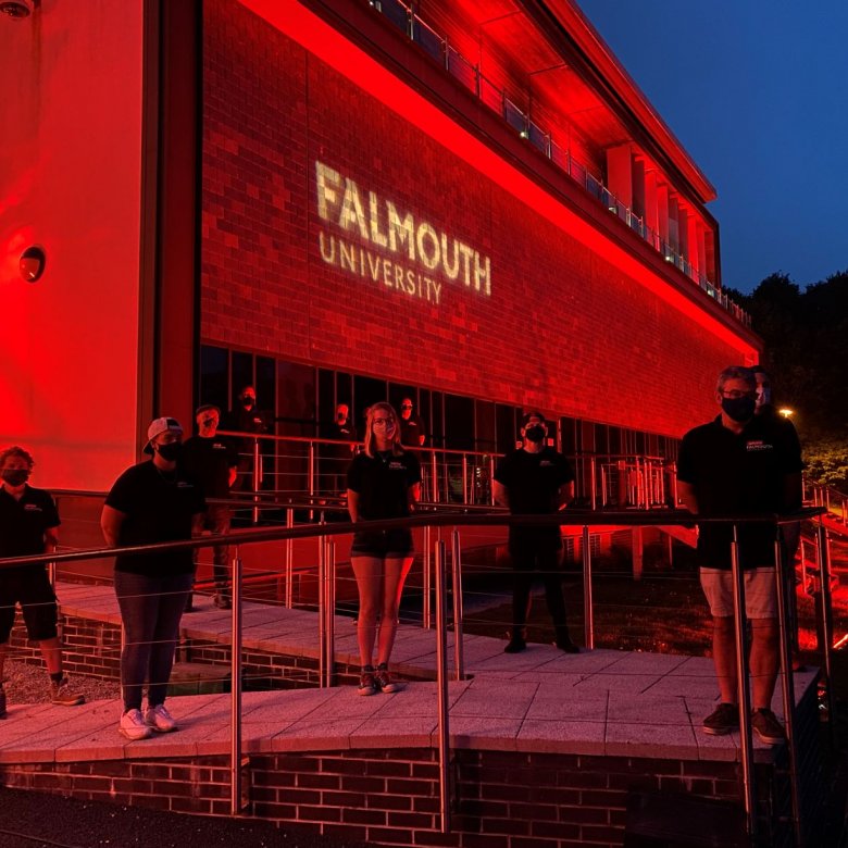 Falmouth University AMATA building shines red in support of #WeMakeEvents