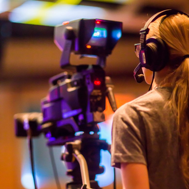 A woman operates a camera