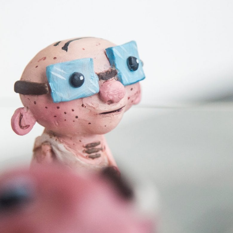 Animation BA(Hons) model of a bald man wearing large blue glasses