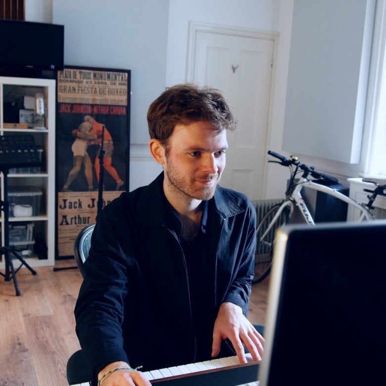Graduate, Joe Donohoe, on the piano