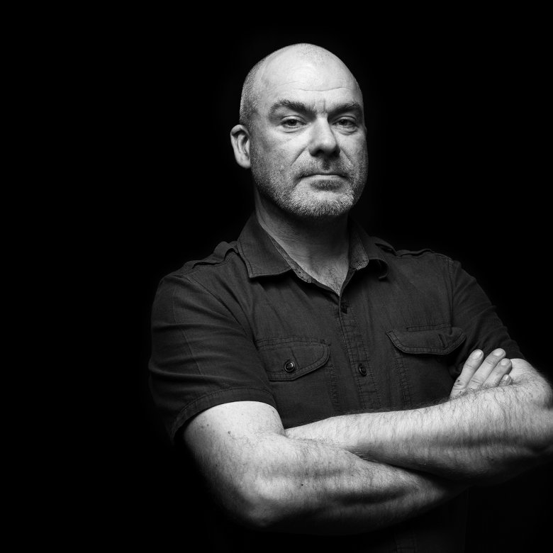 Portrait photo of Neill Gorton in black and white