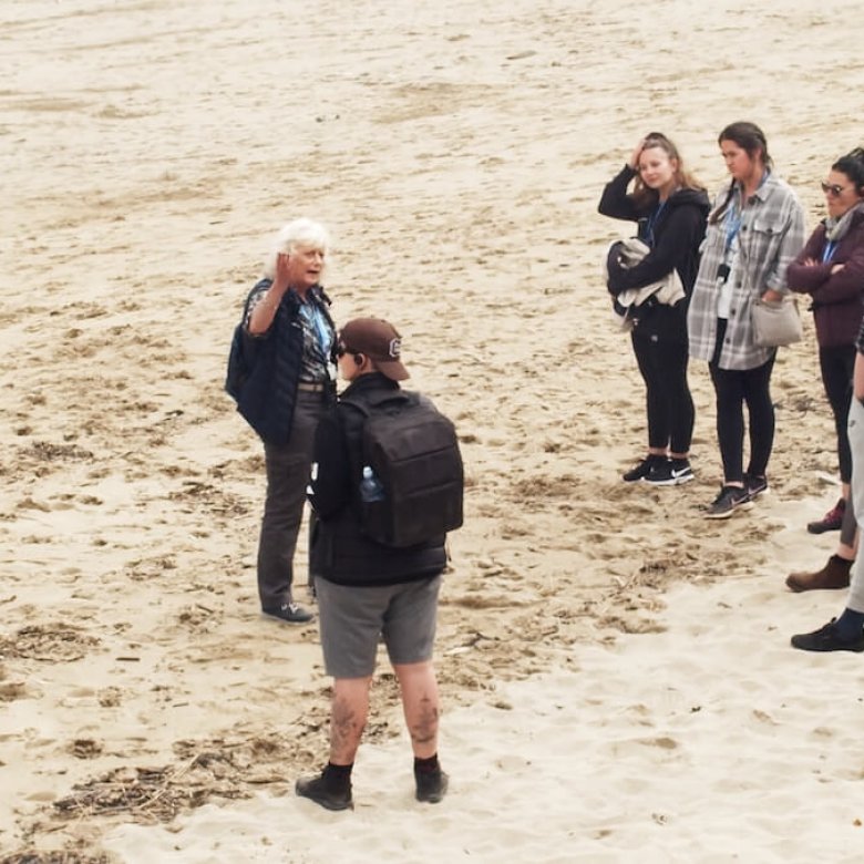 Sustainable Tourism Management students with tour guide on Portreath beach