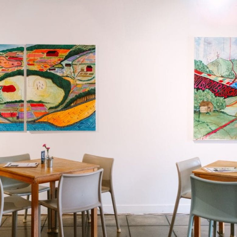 Seats and paintings in a cafe environment
