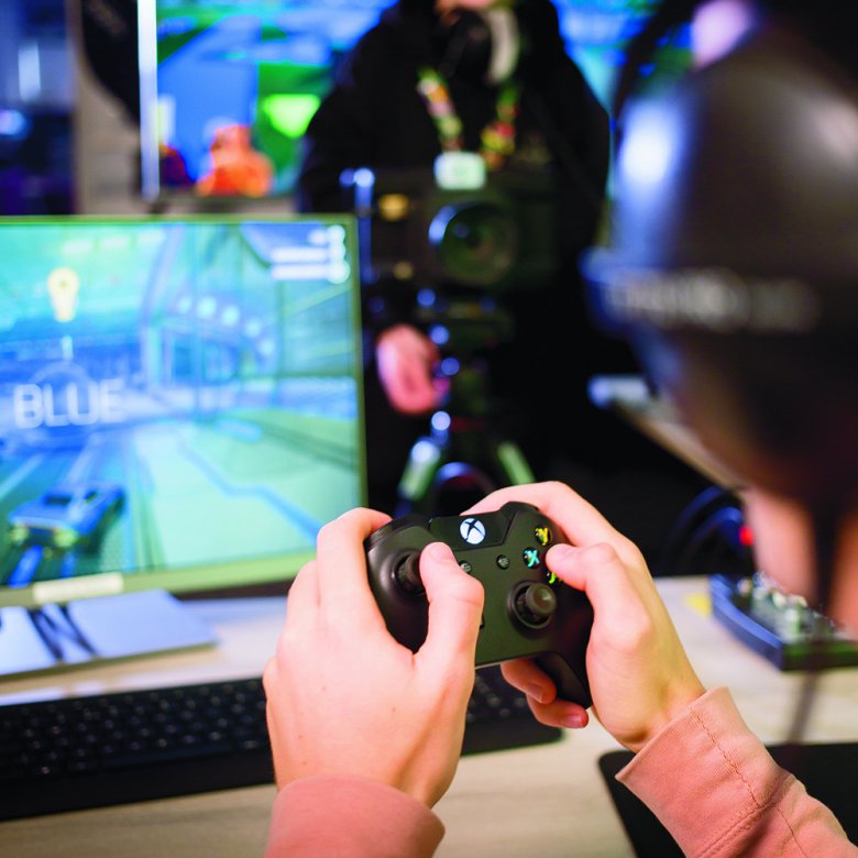 Games academy students using equipment
