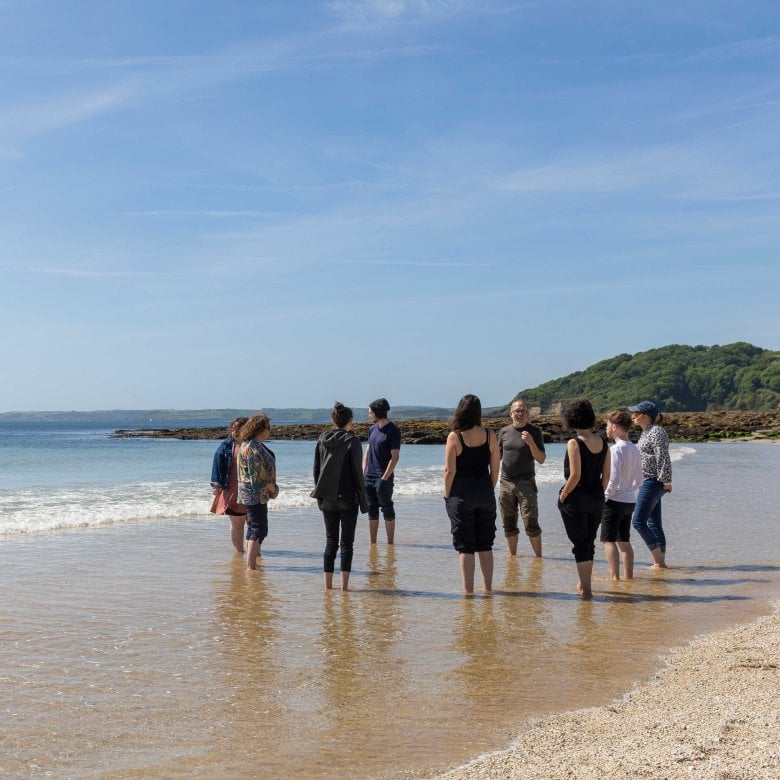 BA Creative Writing (Online) students on the beach with Wyl Menmuir 