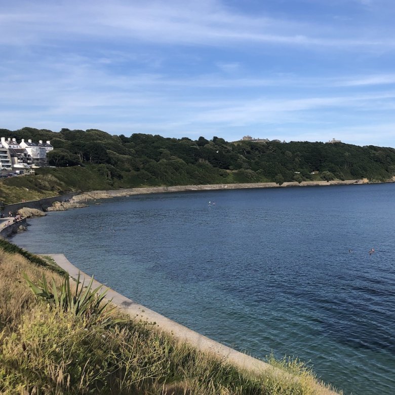 View of Castle Beach in Falmouth with Pendennis Castle in the background