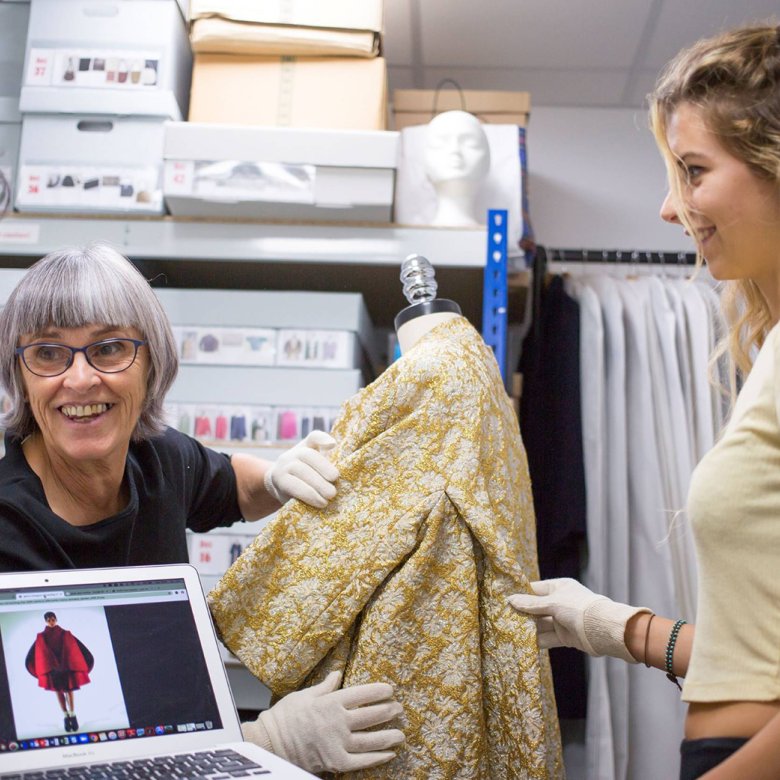 Di Downs working with two students in the costume stores at Falmouth University