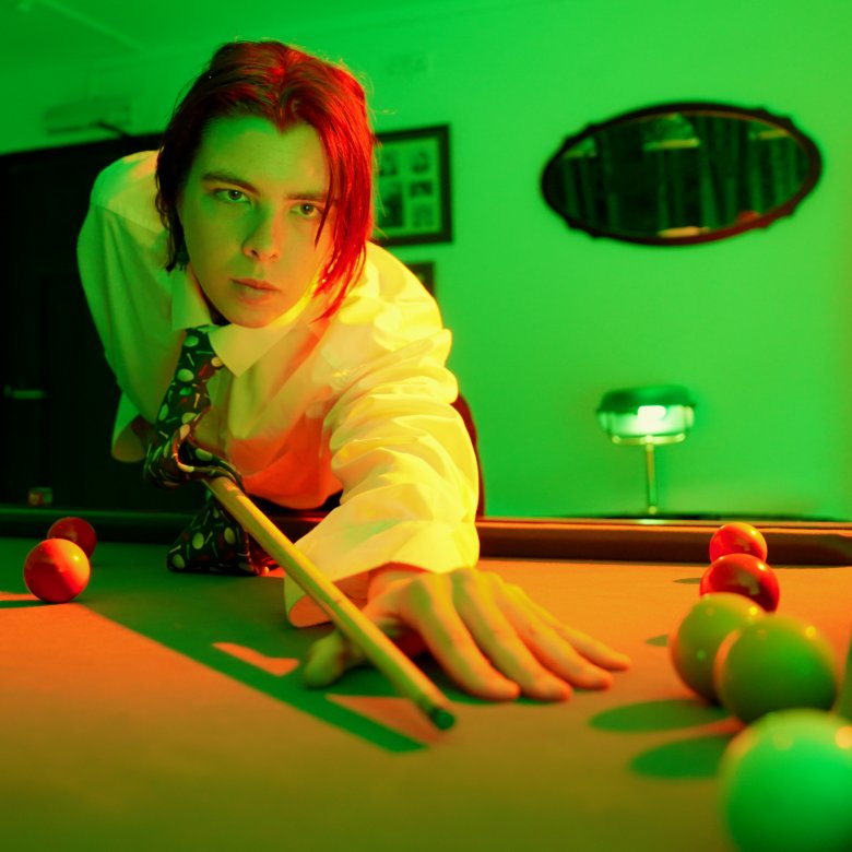 A student playing pool