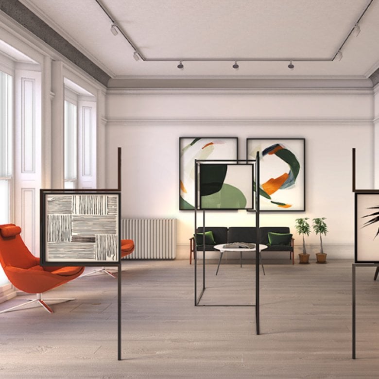 Interior design of large room with orange and green chairs and framed patterns