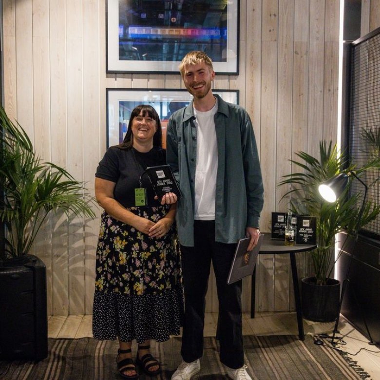 Photo of Torgeir Rorvik holding Graduate Fashion Week Award at the 2022 event