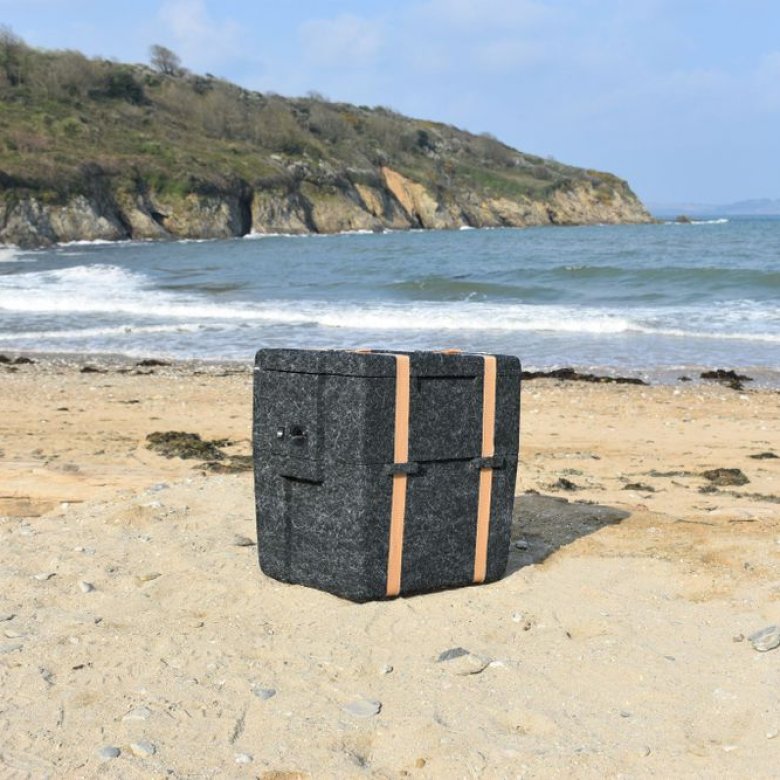 WoolBox Cooler (designed by Falmouth University graduate) on a beach