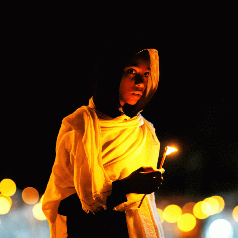A boy holding a candle at Ethiopia