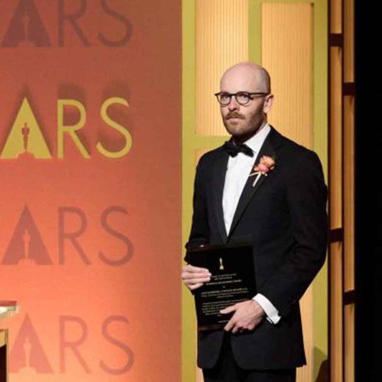 A graduate with an Oscar