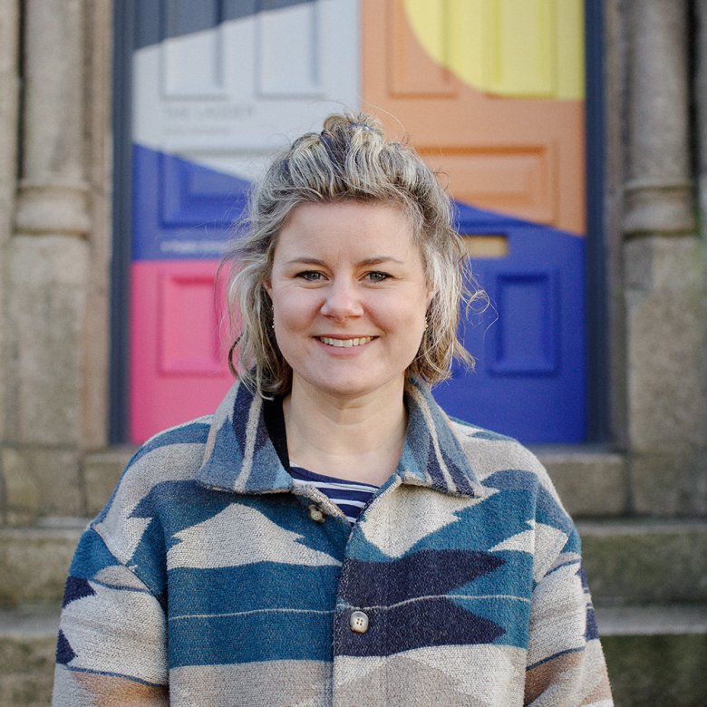 A woman stood outside a building