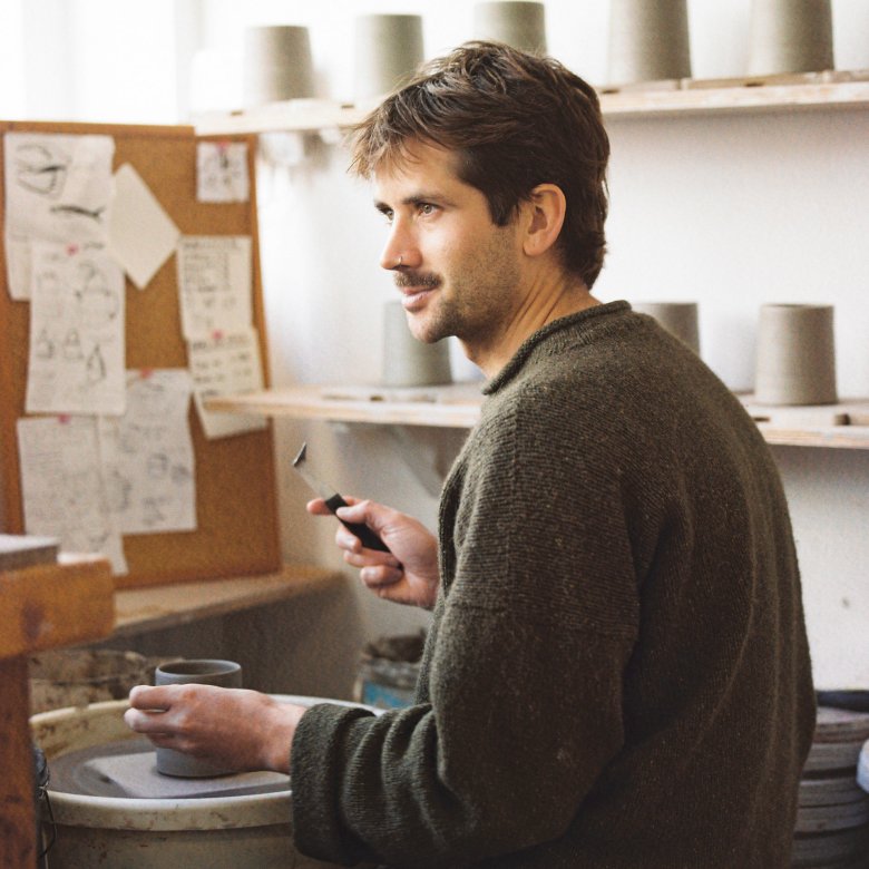 A man at a pottery wheel 