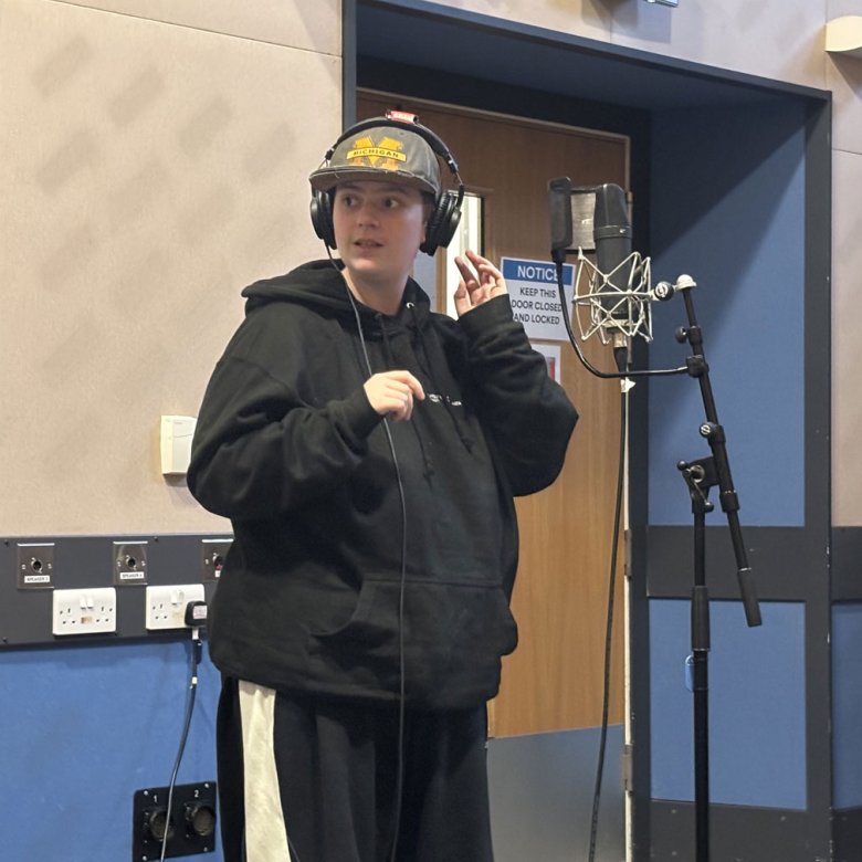 A Musical Theatre student in the recording studio at Falmouth University