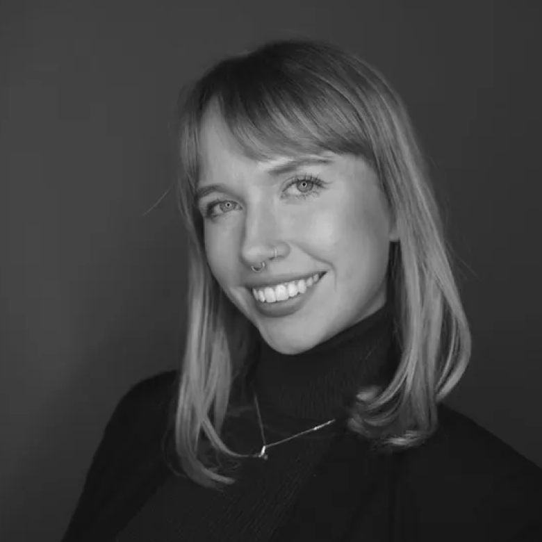 A woman smiling into the camera