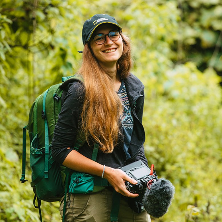 Hedvika Michnova on a location shoot carrying a camera 