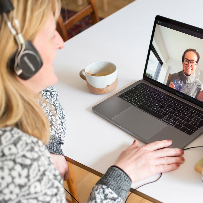 Adult learner taking part in an online seminar on their laptop