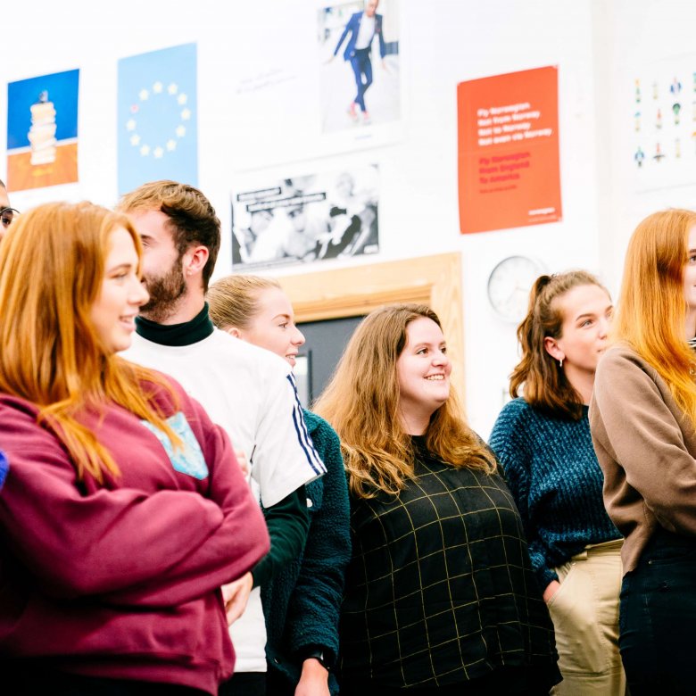 Creative advertising students standing together