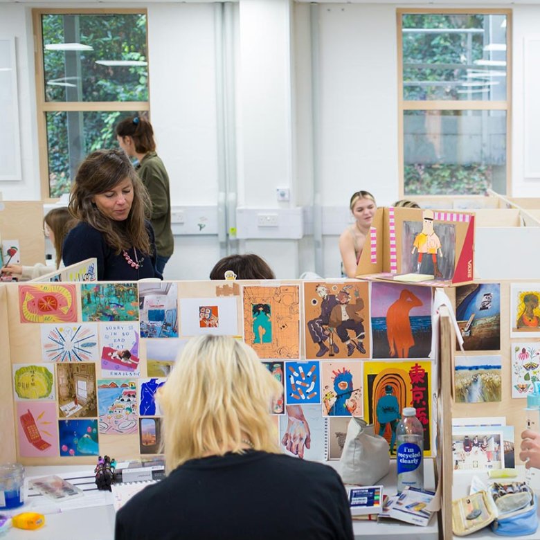 Students working in illustration studios at Falmouth University
