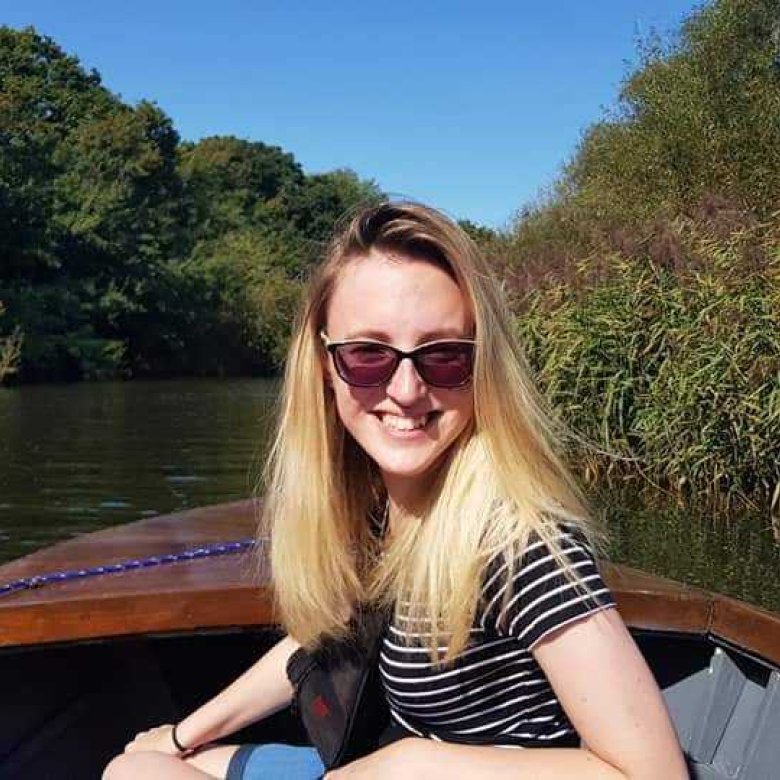 Student Lucy sat on a small boat on a lake