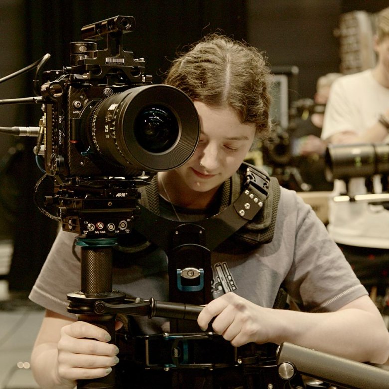A female student operating an ARRI camera at Falmouth University
