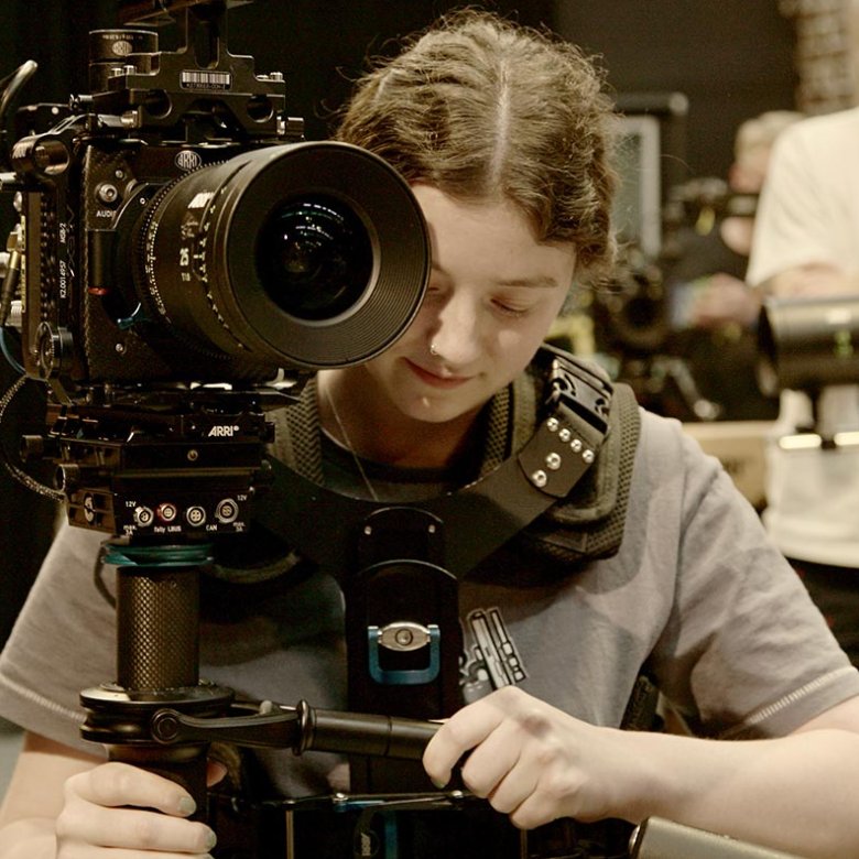 A female student operating an ARRI camera at Falmouth University
