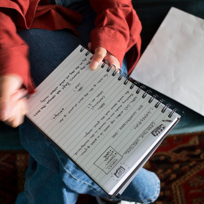 A woman writing in a notebook