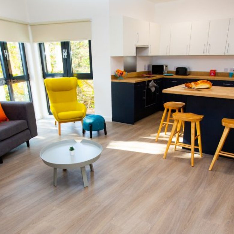 A living room with sofas and chairs