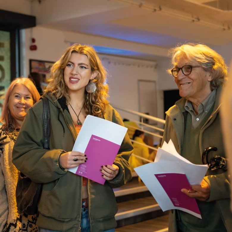 A young woman with her parents at a Falmouth University Open Day