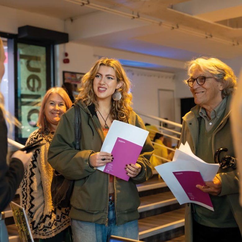 A young woman with her parents at a Falmouth University Open Day