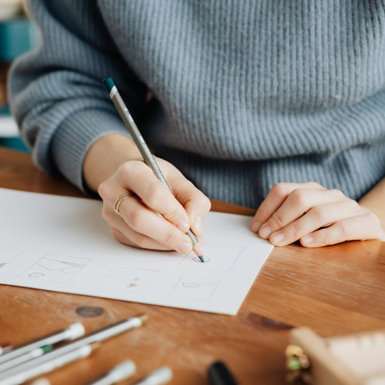 Close up of a woman drawing a sketch