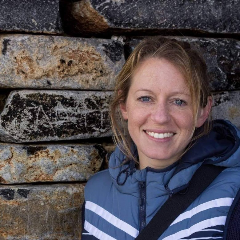 A woman smiling into the camera