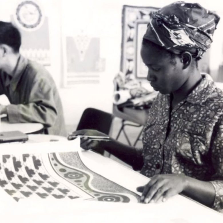 A woman examines textiles