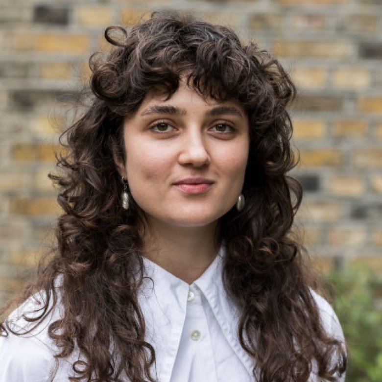 A woman smiling into the camera