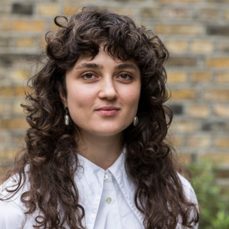 A woman smiling into the camera