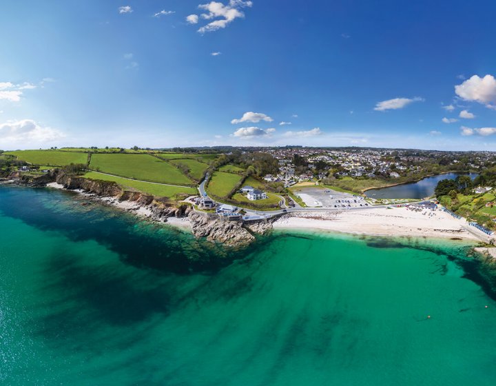 Aerial View Of Swanpool Beach with sea and cliffs